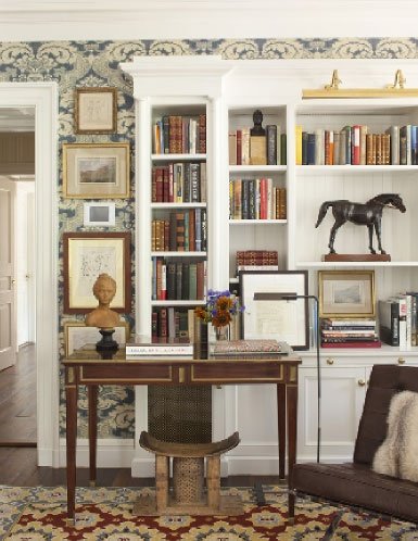 The art of bookcase styling - David Netto design - The "centerpiece" leather racehorse was found in London. Photo Johnathan Wallen.