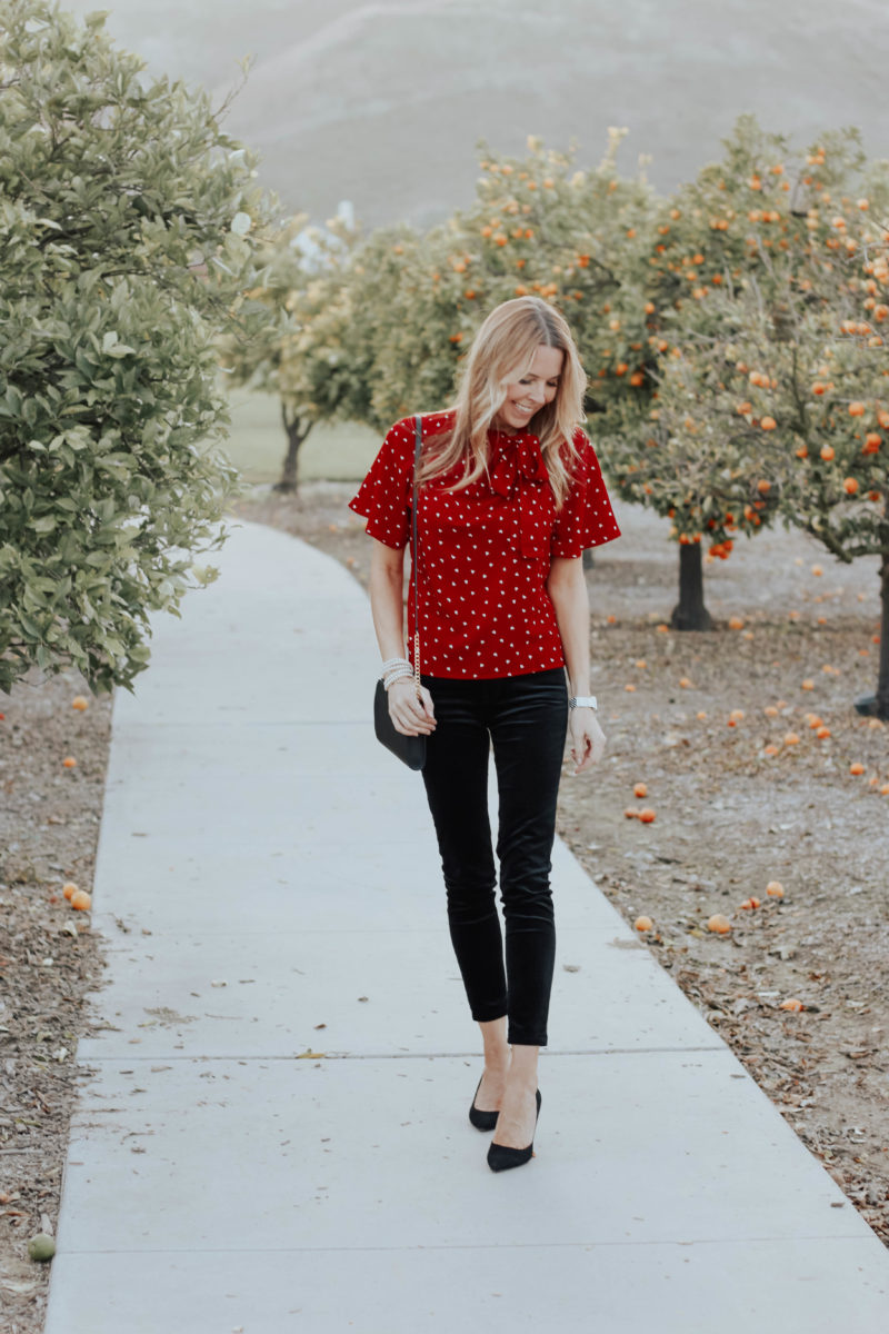 Red blouse black store pants