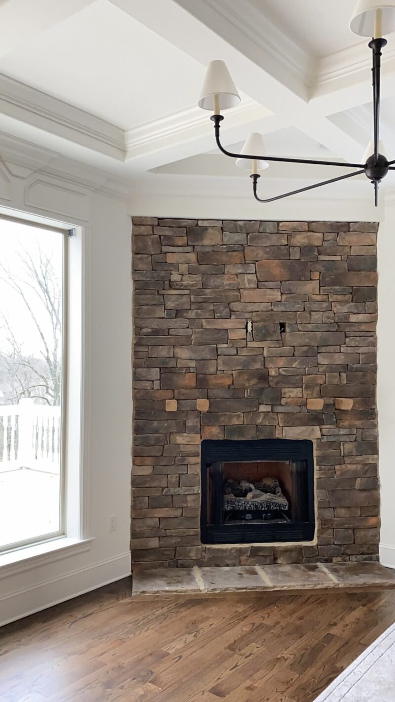the before stacked stone fireplace