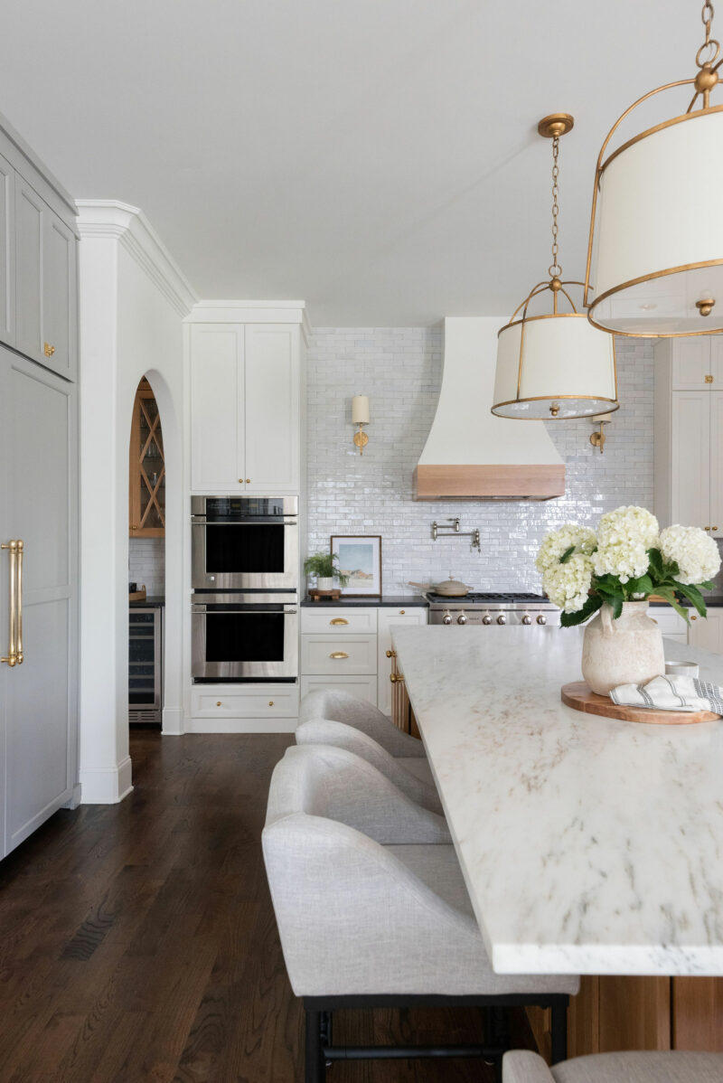 Tour a Spacious Gold and White Chef's Kitchen With Grand Island