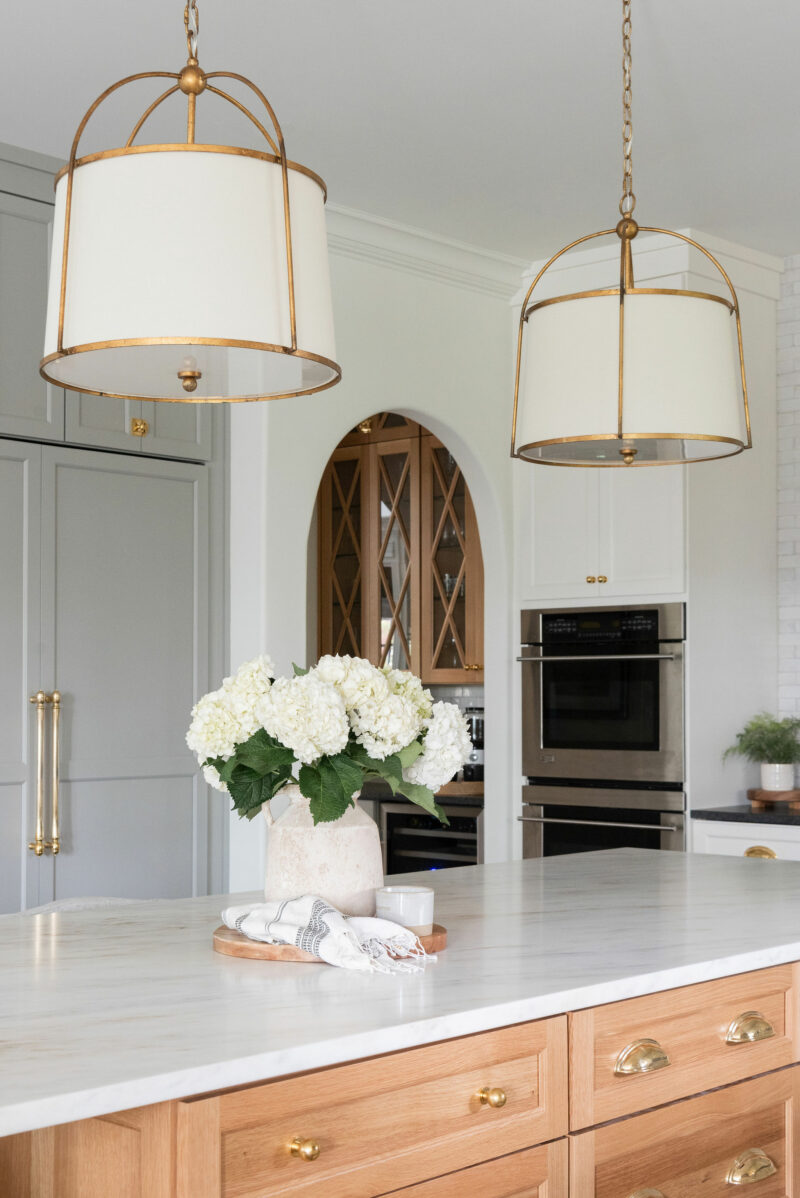 Tour a Spacious Gold and White Chef's Kitchen With Grand Island